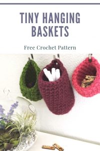 A photo of three small hanging baskets - a crochet pattern to make them
