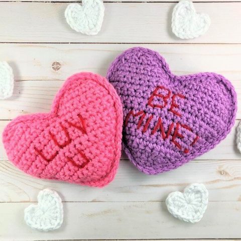 photo of two crocheted conversation heart pillows