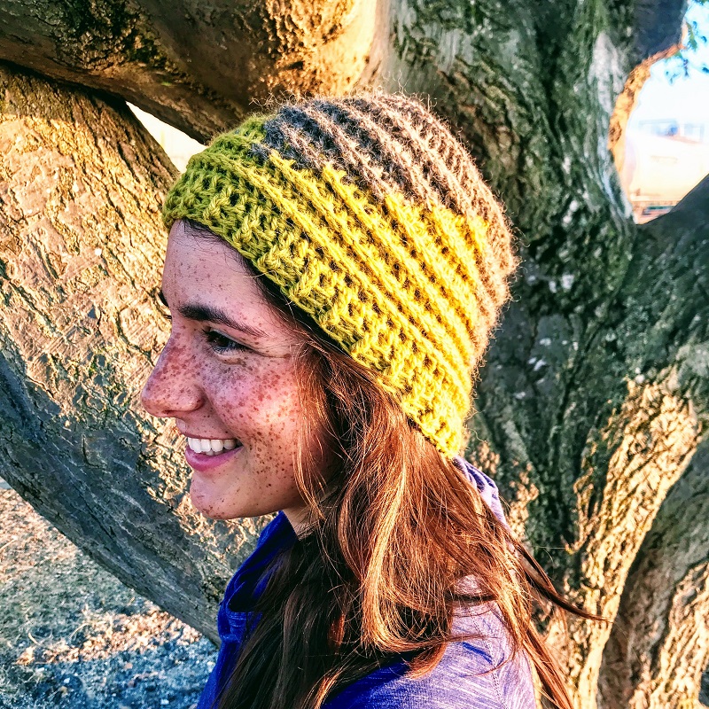Photo of a woman enjoying the outdoors wearing the crocheted hat